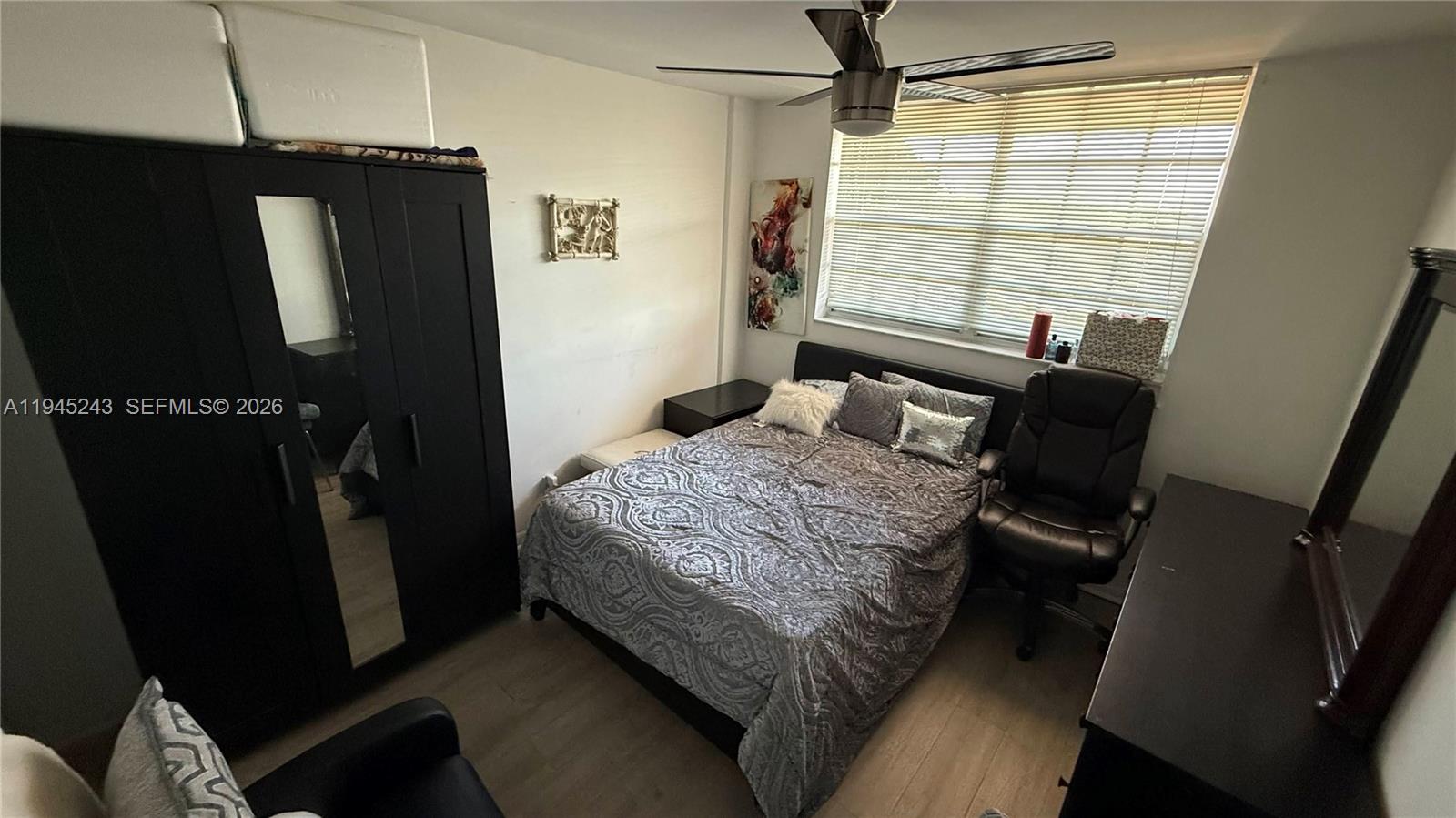 4502 North Federal Highway, Unit 336D Lighthouse Point, FL 33064 - Photo 5 of 12 a bedroom with a bed next to a window