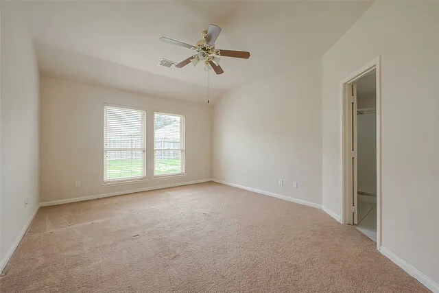 a view of a livingroom with a ceiling fan