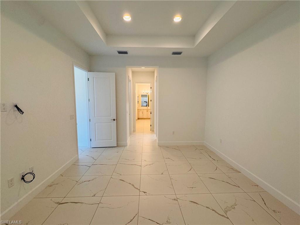 2864 Bloomfield Way Naples, FL 34112 - Photo 22 of 40 a view of an empty room and window
