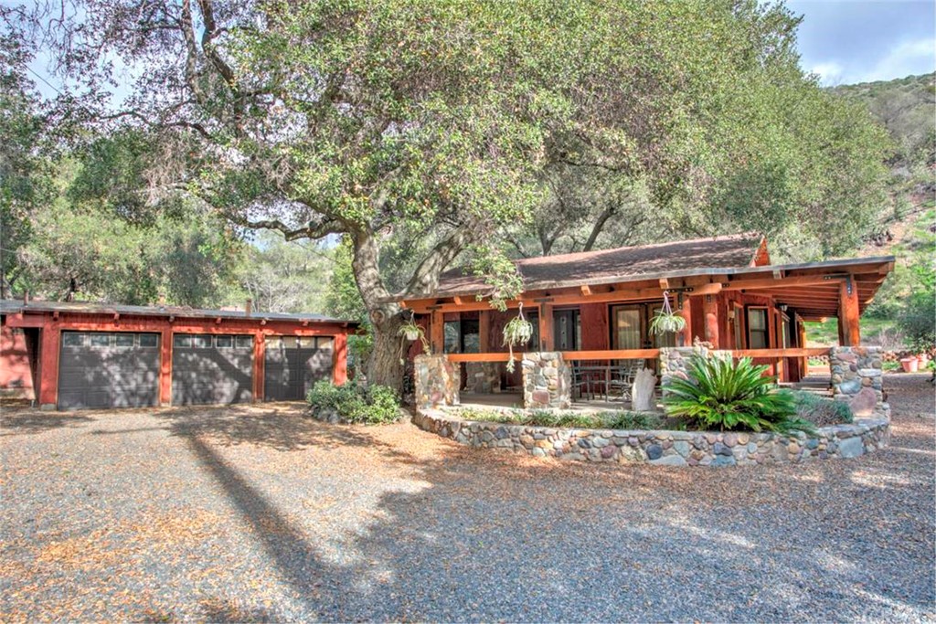 17202 Harding Canyon Road Silverado, CA 92676 - Photo 1 of 1 Front of house showing wrap around porch and 3 car garage