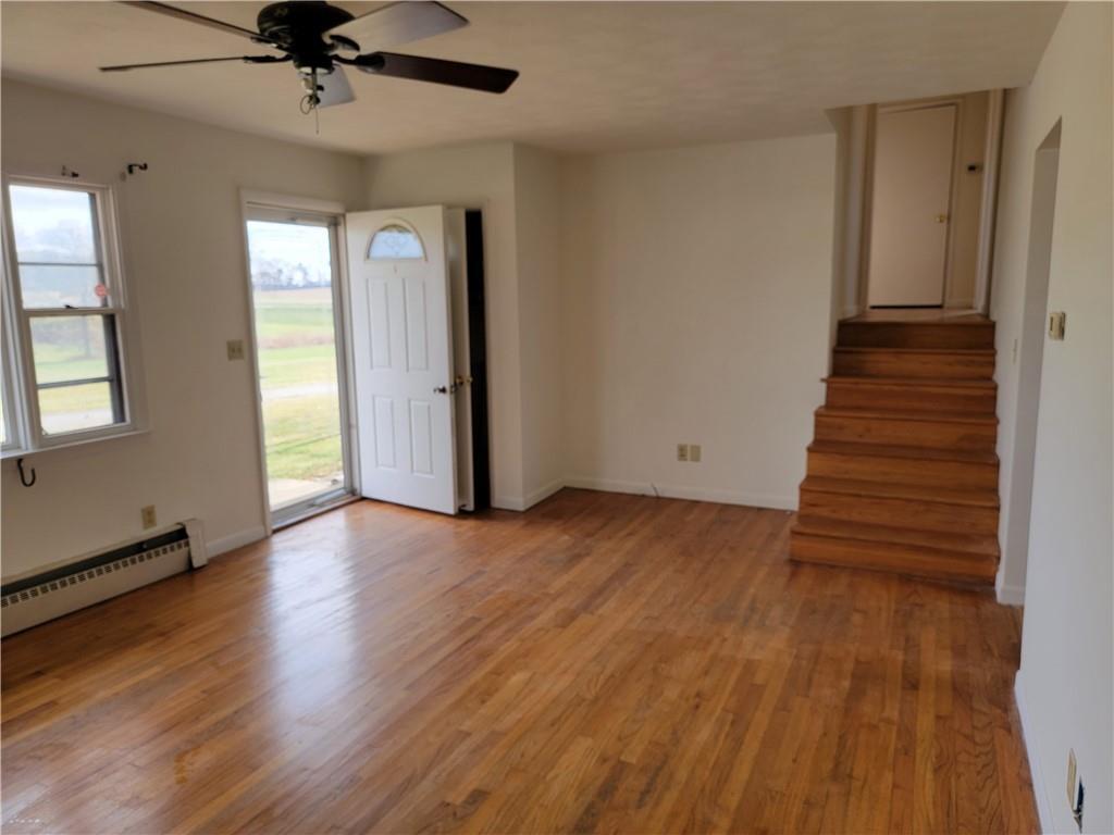 877 North 950 East Road Tower Hill, IL 62571 - Photo 7 of 28 wooden floor in an empty room with a window