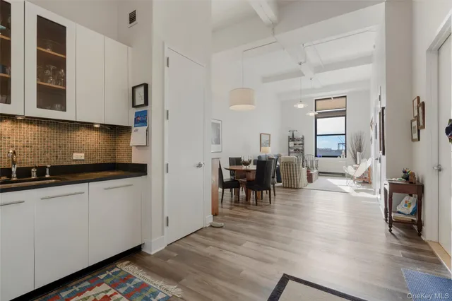 a kitchen with sink cabinets and dining table view