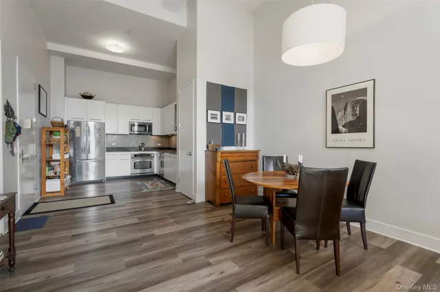 a view of a dining room with furniture and wooden floor