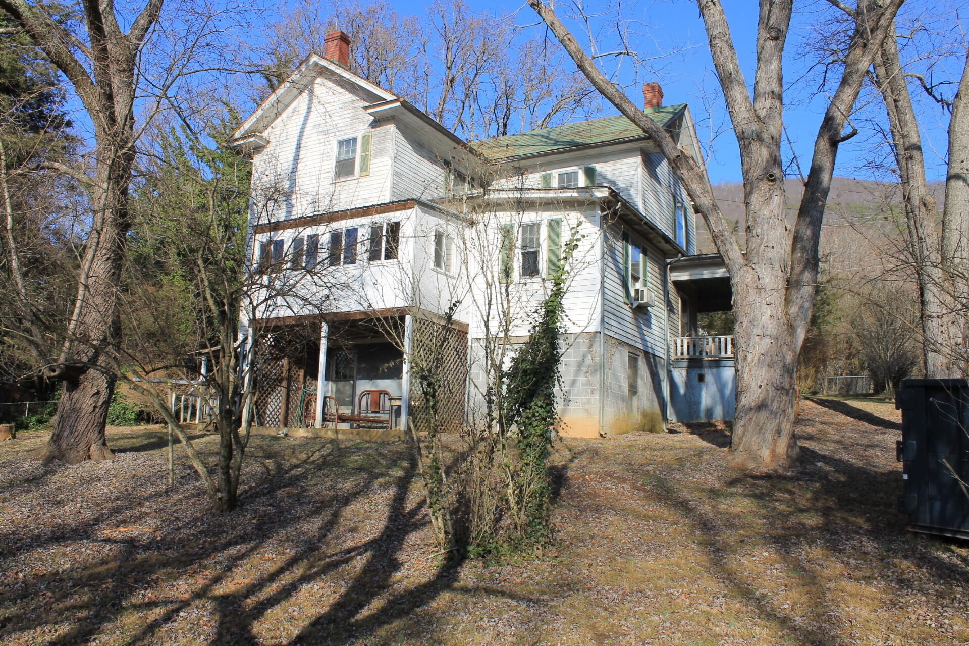1213 Narrow Passage Road Buchanan, VA 24066 - Photo 21 of 21 a view of a white house with a large tree