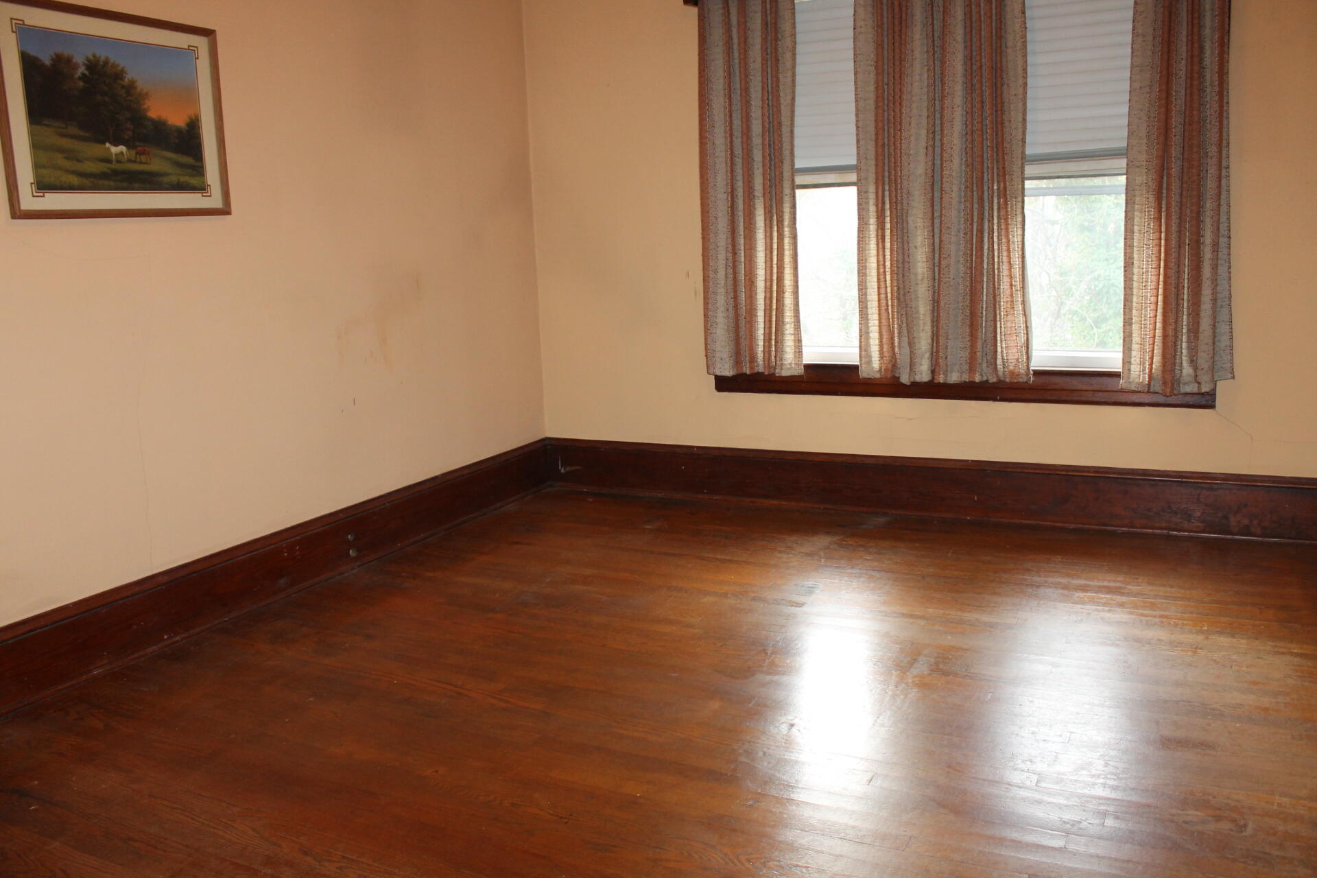 1213 Narrow Passage Road Buchanan, VA 24066 - Photo 10 of 21 an empty room with wooden floor and windows