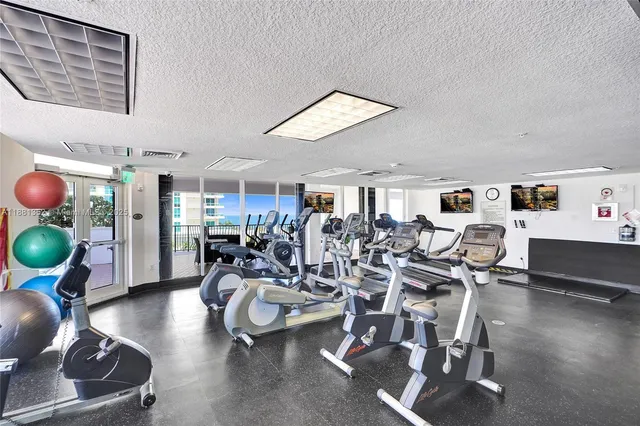 a living room with furniture and flowers