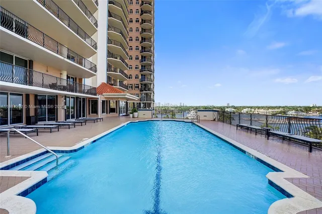 a view of a patio with chairs and a table