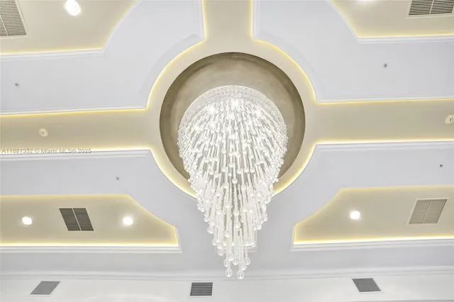 a view of a hallway with wooden floor and a bathroom