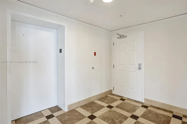 a view of a windows and an entryway in a room