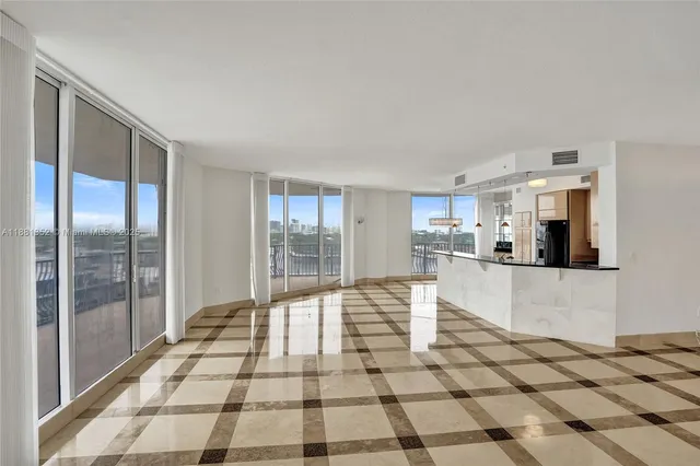 a kitchen with granite countertop a sink and a stove