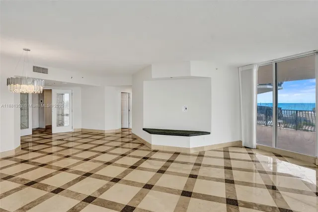 a bath tub sitting next to a bathroom sink and a shower