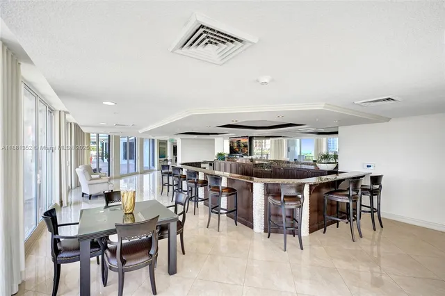 a view of a dining room with furniture and a rug