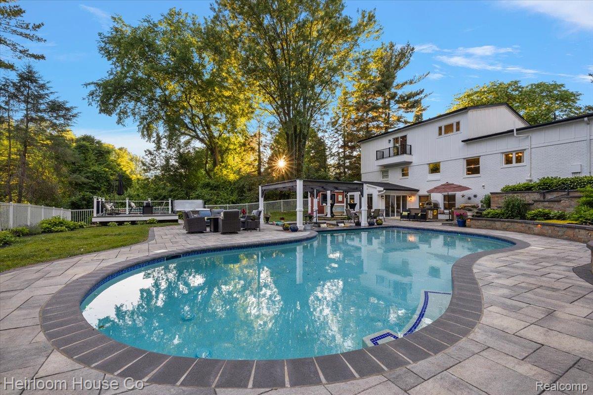49001 Hanford Road Canton, MI 48187 - Photo 88 of 98 Curved inground pool with paver surround and integrated steps