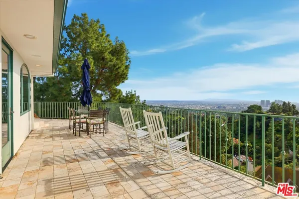 a view of a chairs with a small yard