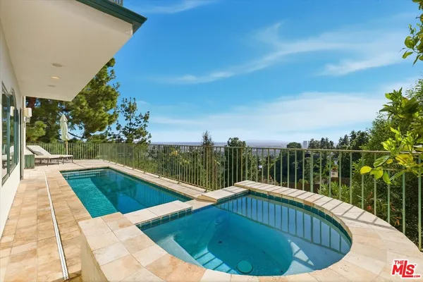 a view of swimming pool from a balcony