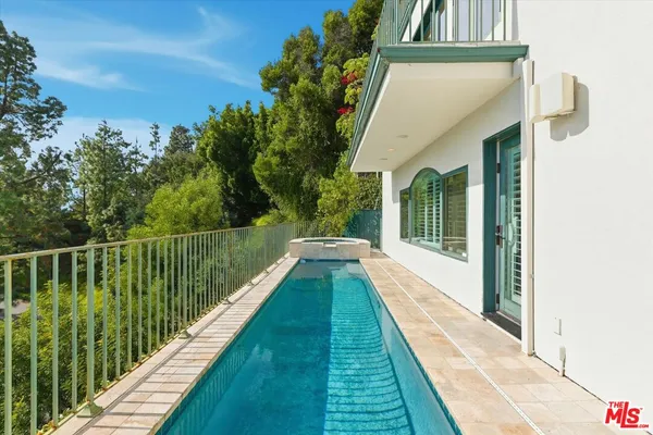 a view of balcony with yard