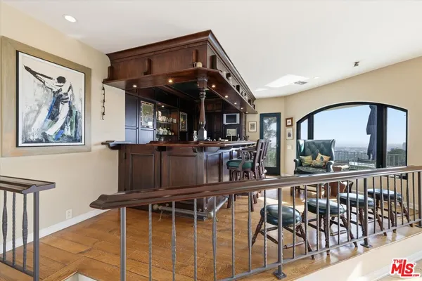 a view of a chairs and table in a balcony