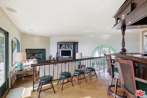 a view of a livingroom with furniture and a flat screen tv