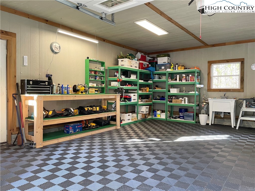 541 Woodland Ridge Lansing, NC 28643 - Photo 13 of 45 a room with lots of furniture and a book shelf