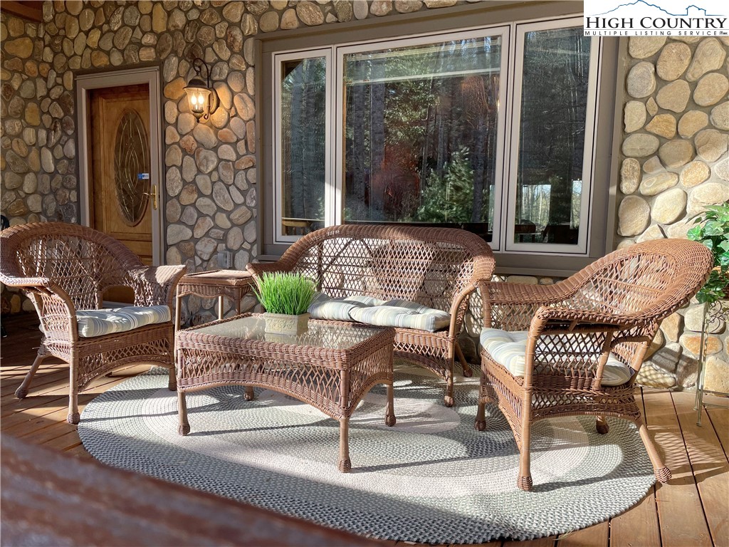541 Woodland Ridge Lansing, NC 28643 - Photo 15 of 45 a view of a house with backyard and sitting area