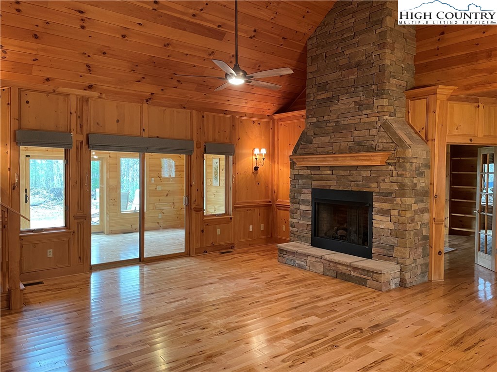 541 Woodland Ridge Lansing, NC 28643 - Photo 17 of 45 a view of empty room with wooden floor and fireplace