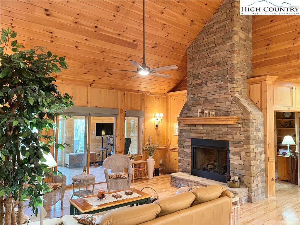 541 Woodland Ridge Lansing, NC 28643 - Photo 20 of 45 a outdoor space with the couches and a fireplace
