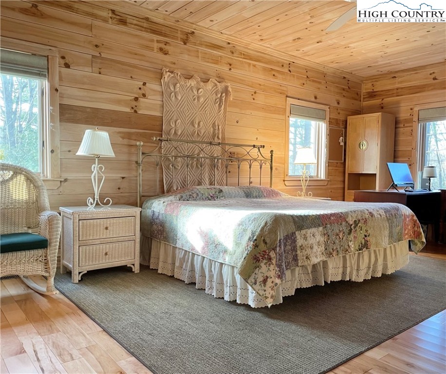 541 Woodland Ridge Lansing, NC 28643 - Photo 31 of 45 a spacious bedroom with a bed and a cabinets