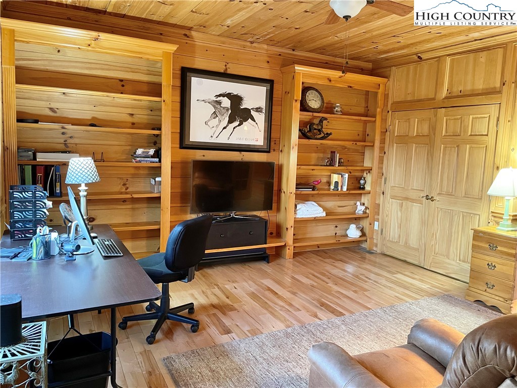 541 Woodland Ridge Lansing, NC 28643 - Photo 35 of 45 a room with furniture and a flat screen tv