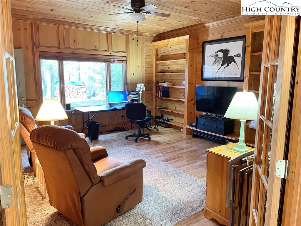 541 Woodland Ridge Lansing, NC 28643 - Photo 36 of 45 a living room with furniture a rug and a window