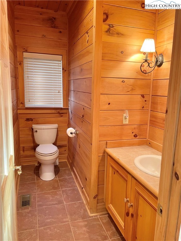 541 Woodland Ridge Lansing, NC 28643 - Photo 37 of 45 a bathroom with a sink a toilet and shower