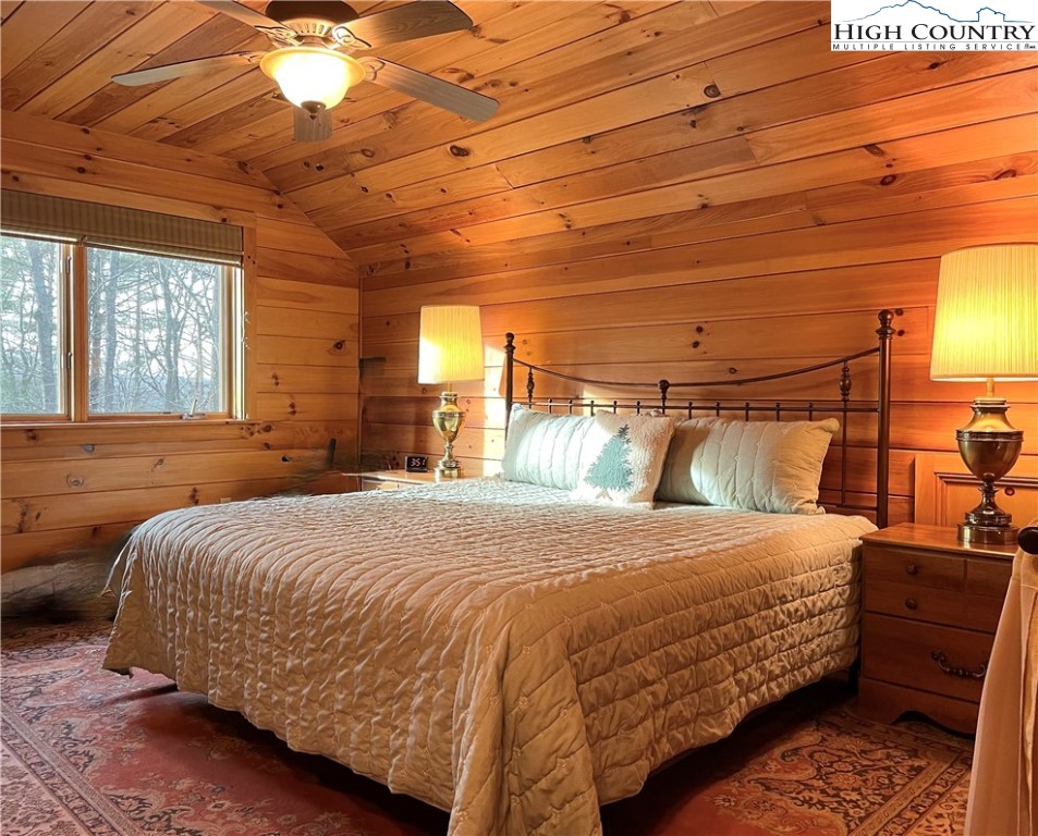 541 Woodland Ridge Lansing, NC 28643 - Photo 39 of 45 a bedroom with a bed and window