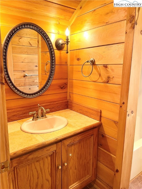 541 Woodland Ridge Lansing, NC 28643 - Photo 40 of 45 a bathroom with a sink and a mirror