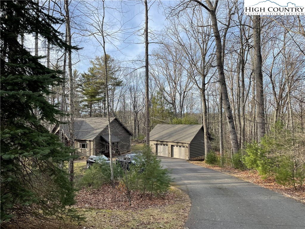 541 Woodland Ridge Lansing, NC 28643 - Photo 5 of 45 front view of a house with a yard