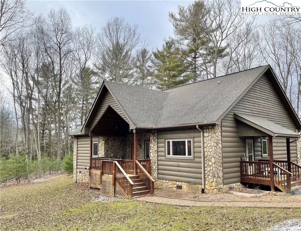 541 Woodland Ridge Lansing, NC 28643 - Photo 7 of 45 a front view of a house with garden