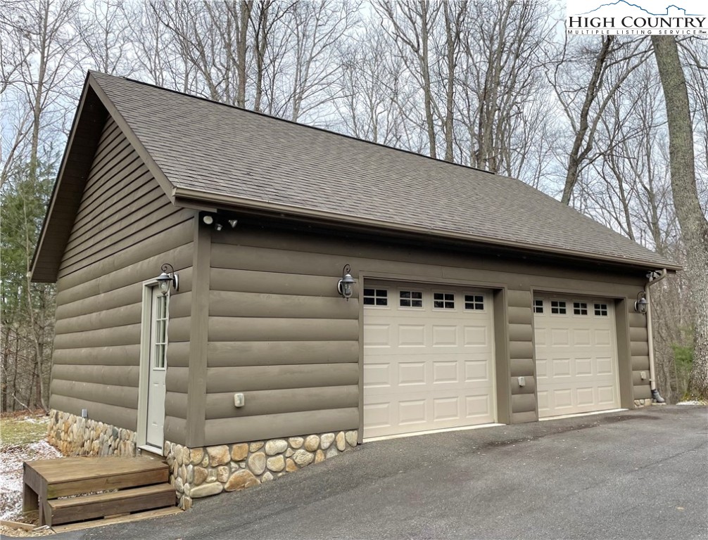 541 Woodland Ridge Lansing, NC 28643 - Photo 9 of 45 a front view of a house with a garage