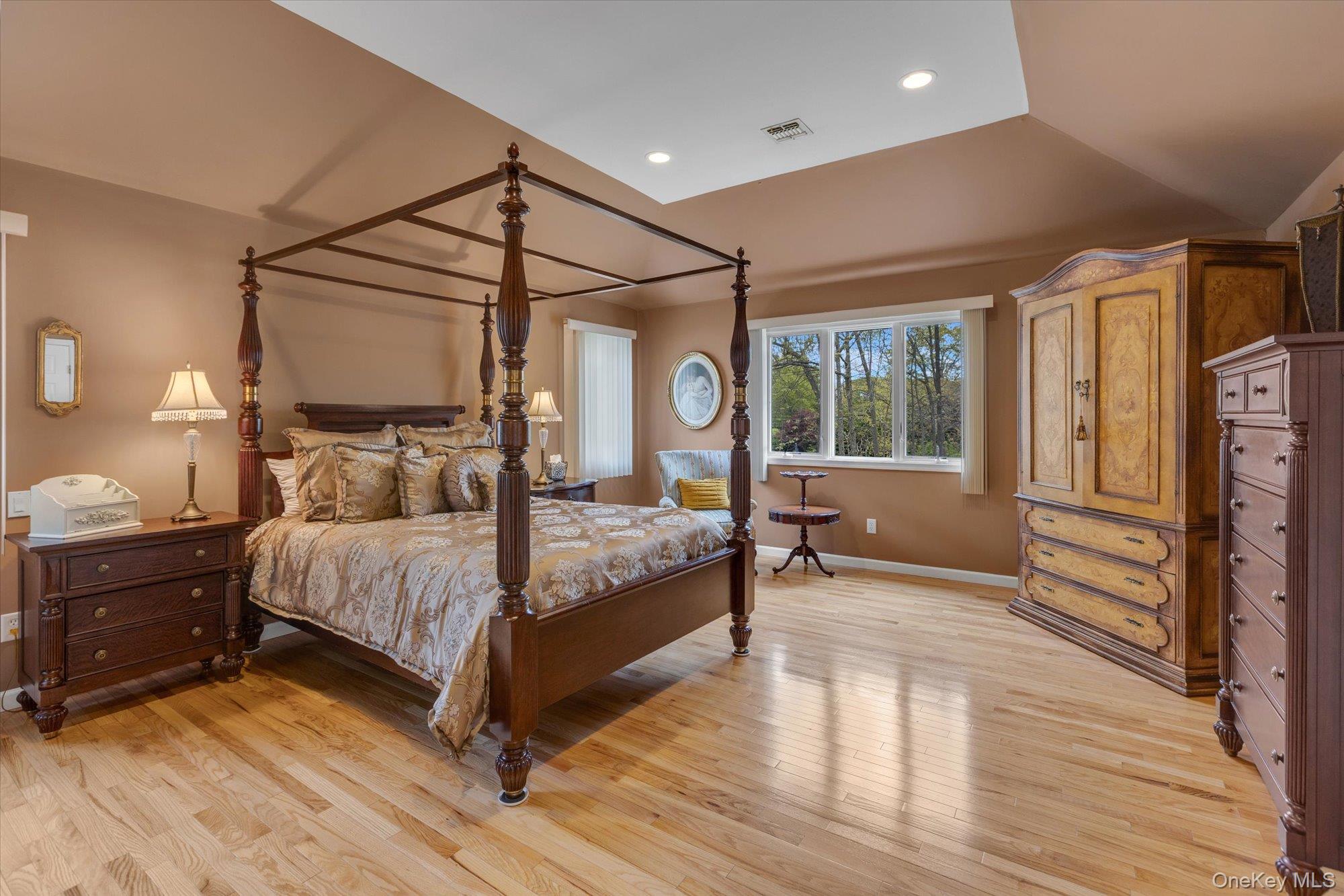 263 Old Commack Road Kings Park, NY 11754 - Photo 15 of 42 a bedroom with a bed and wooden floor