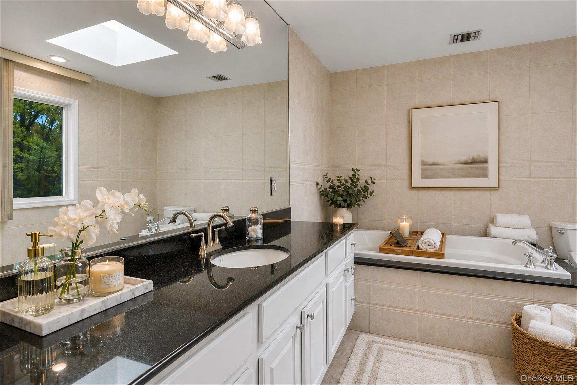 263 Old Commack Road Kings Park, NY 11754 - Photo 16 of 42 a bathroom with a sink and a mirror
