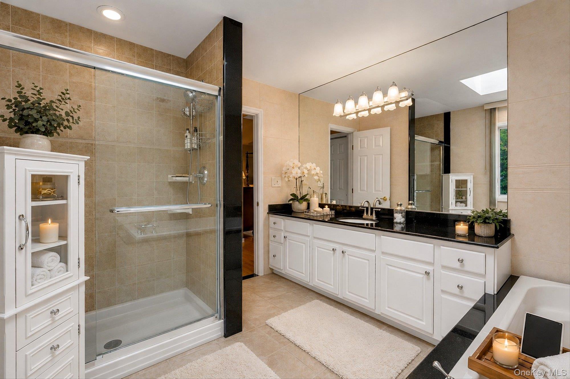 263 Old Commack Road Kings Park, NY 11754 - Photo 17 of 42 a bathroom with a double vanity sink a mirror and a shower
