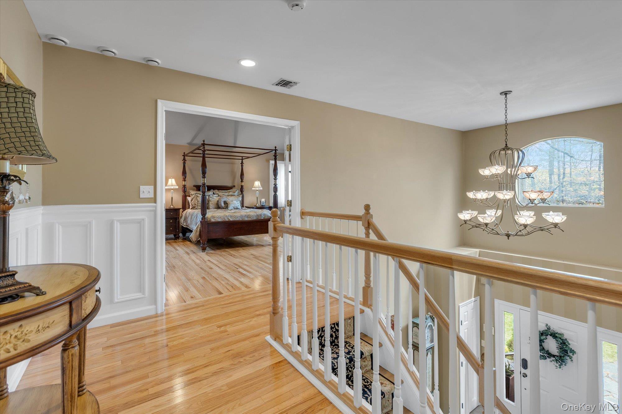 263 Old Commack Road Kings Park, NY 11754 - Photo 22 of 42 a view of a livingroom with furniture stairs wooden floor and bedroom view