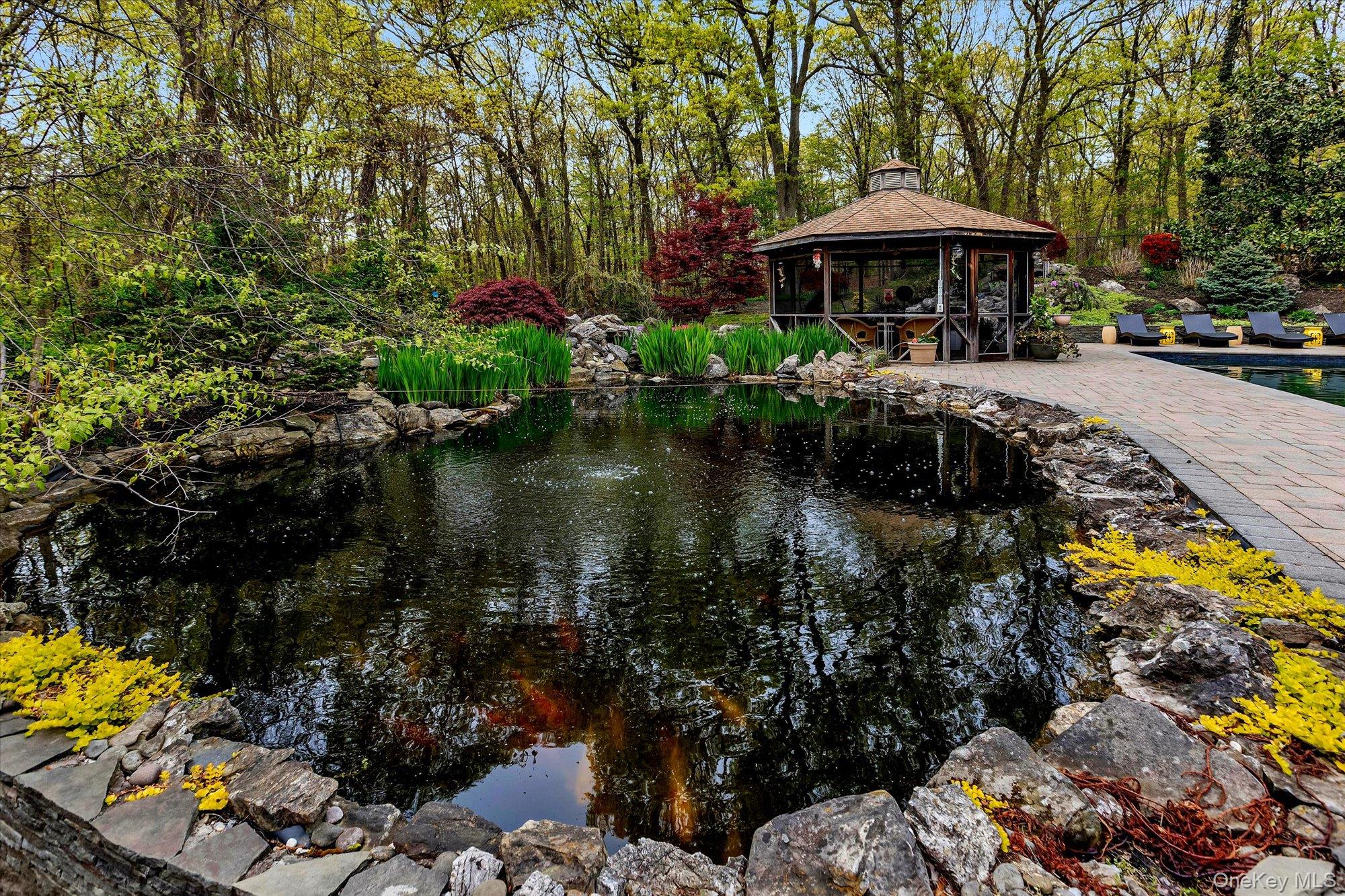 263 Old Commack Road Kings Park, NY 11754 - Photo 24 of 42 a view of a patio with furniture and a lake view