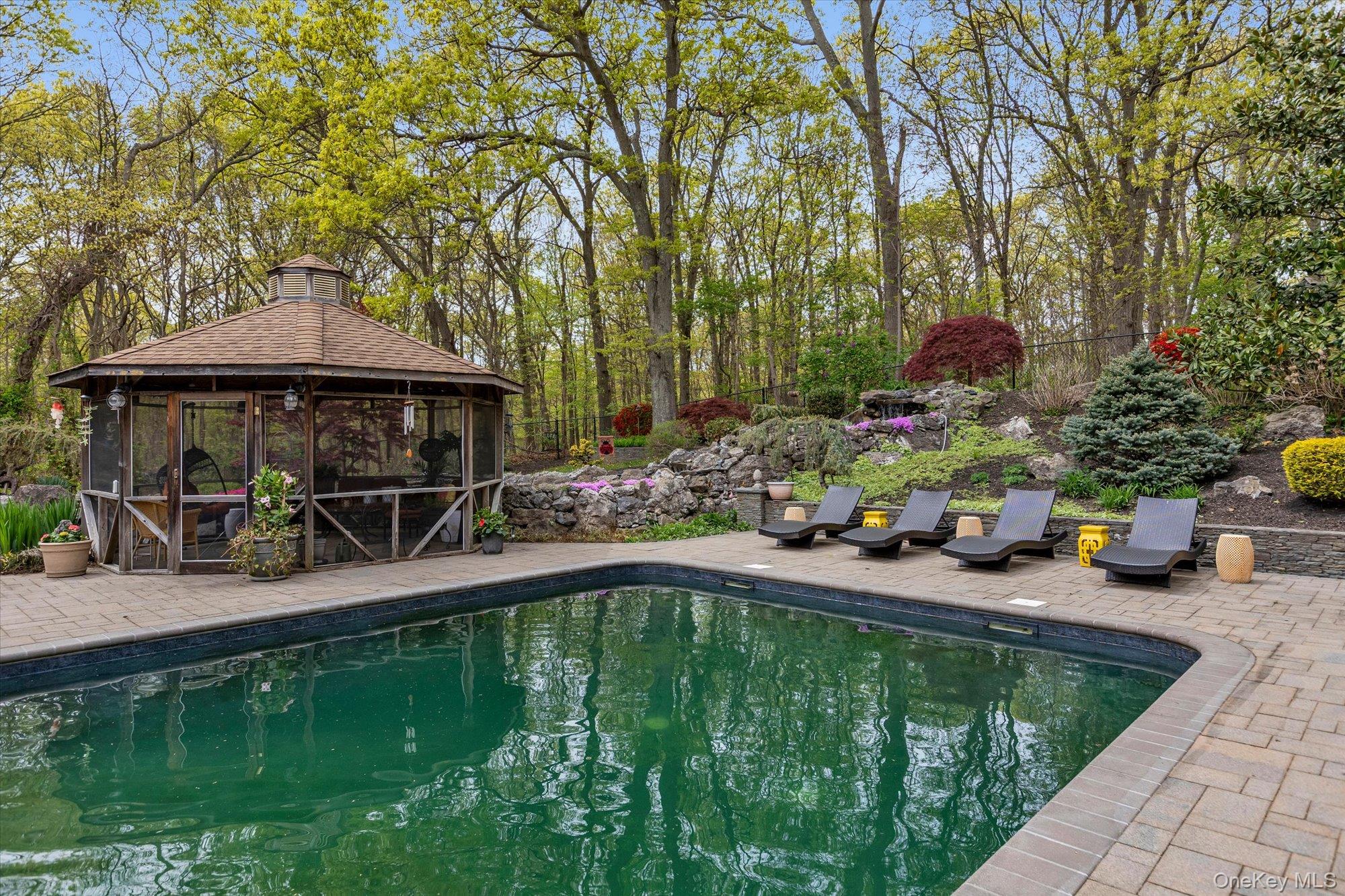 263 Old Commack Road Kings Park, NY 11754 - Photo 26 of 42 an outdoor space with furniture and umbrella