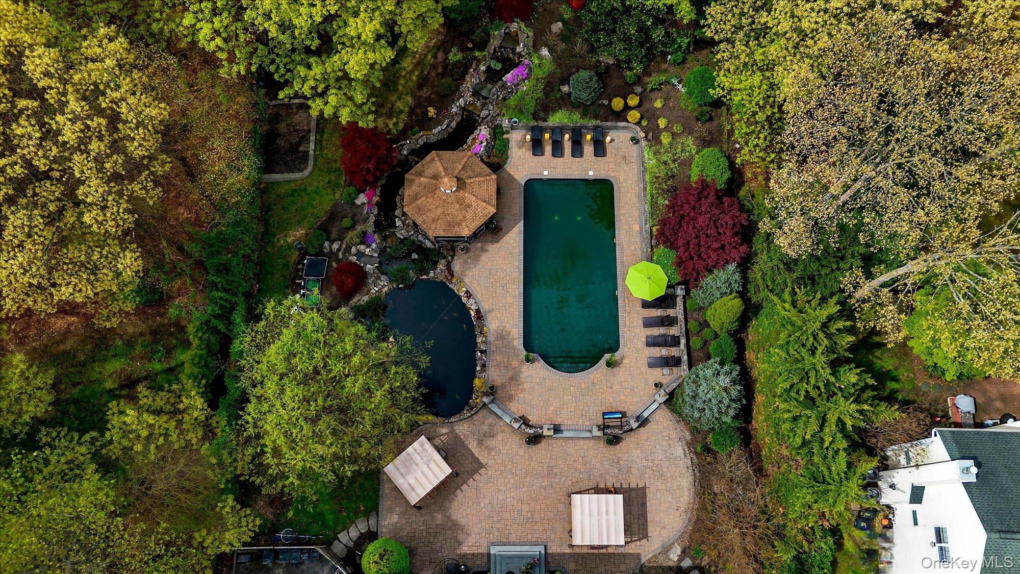 263 Old Commack Road Kings Park, NY 11754 - Photo 32 of 42 an aerial view of a house with a yard and garden