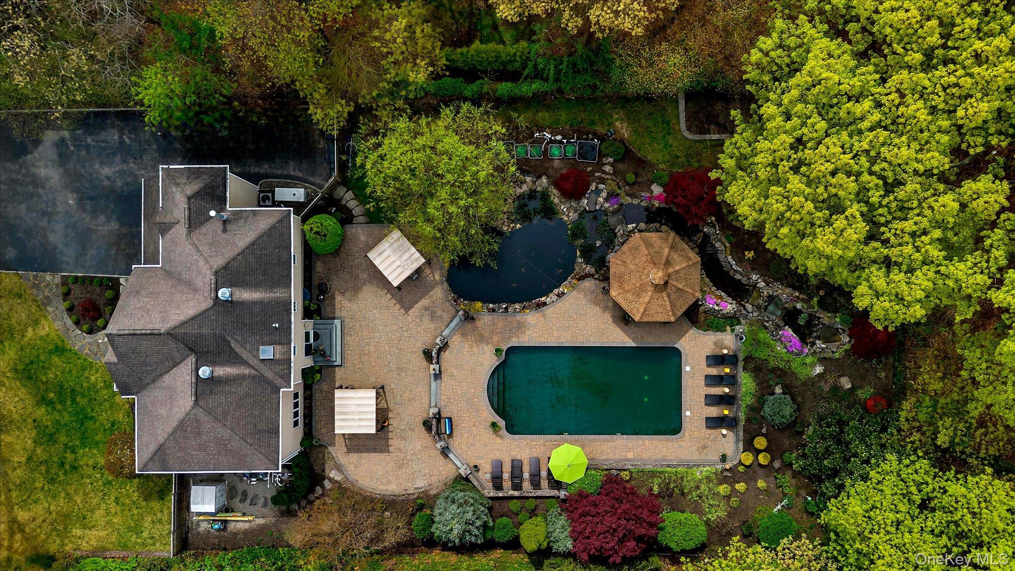263 Old Commack Road Kings Park, NY 11754 - Photo 34 of 42 an aerial view of a house with yard swimming pool and outdoor seating