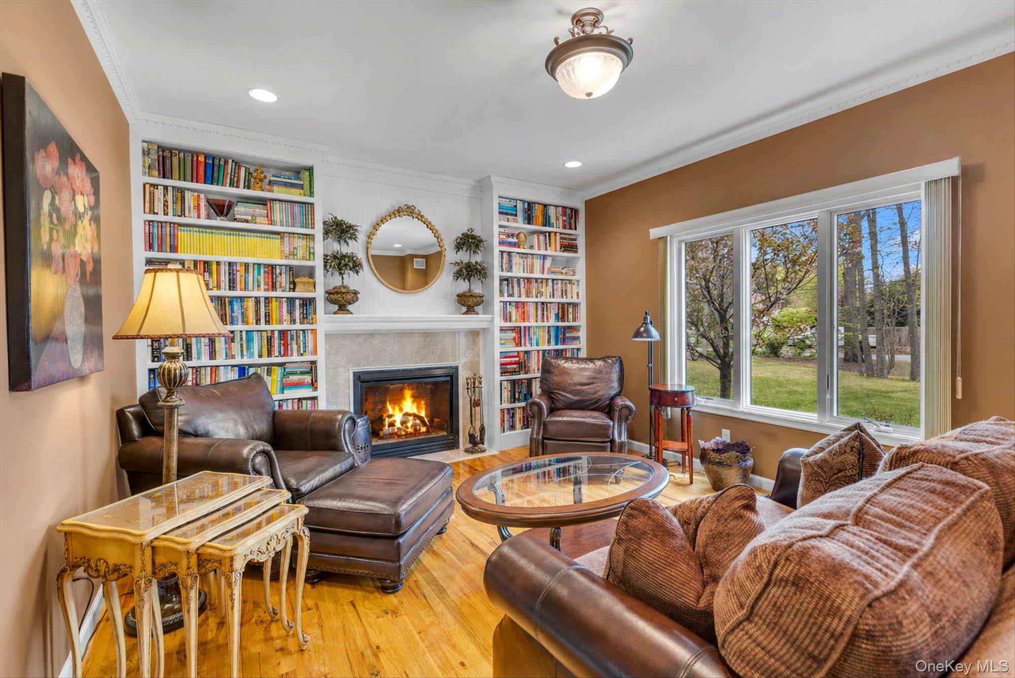 263 Old Commack Road Kings Park, NY 11754 - Photo 5 of 42 a living room with furniture a fireplace and a large window