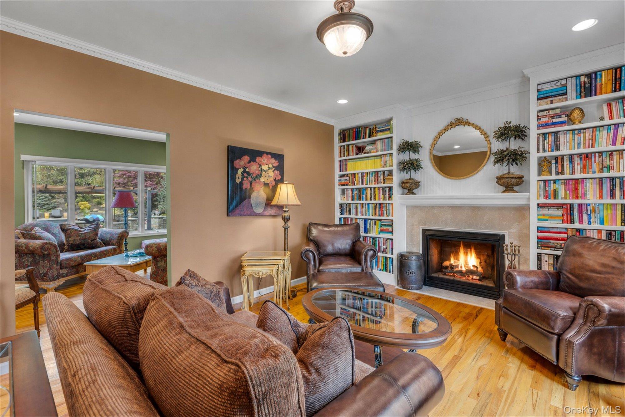 263 Old Commack Road Kings Park, NY 11754 - Photo 6 of 42 a living room with furniture and a fireplace