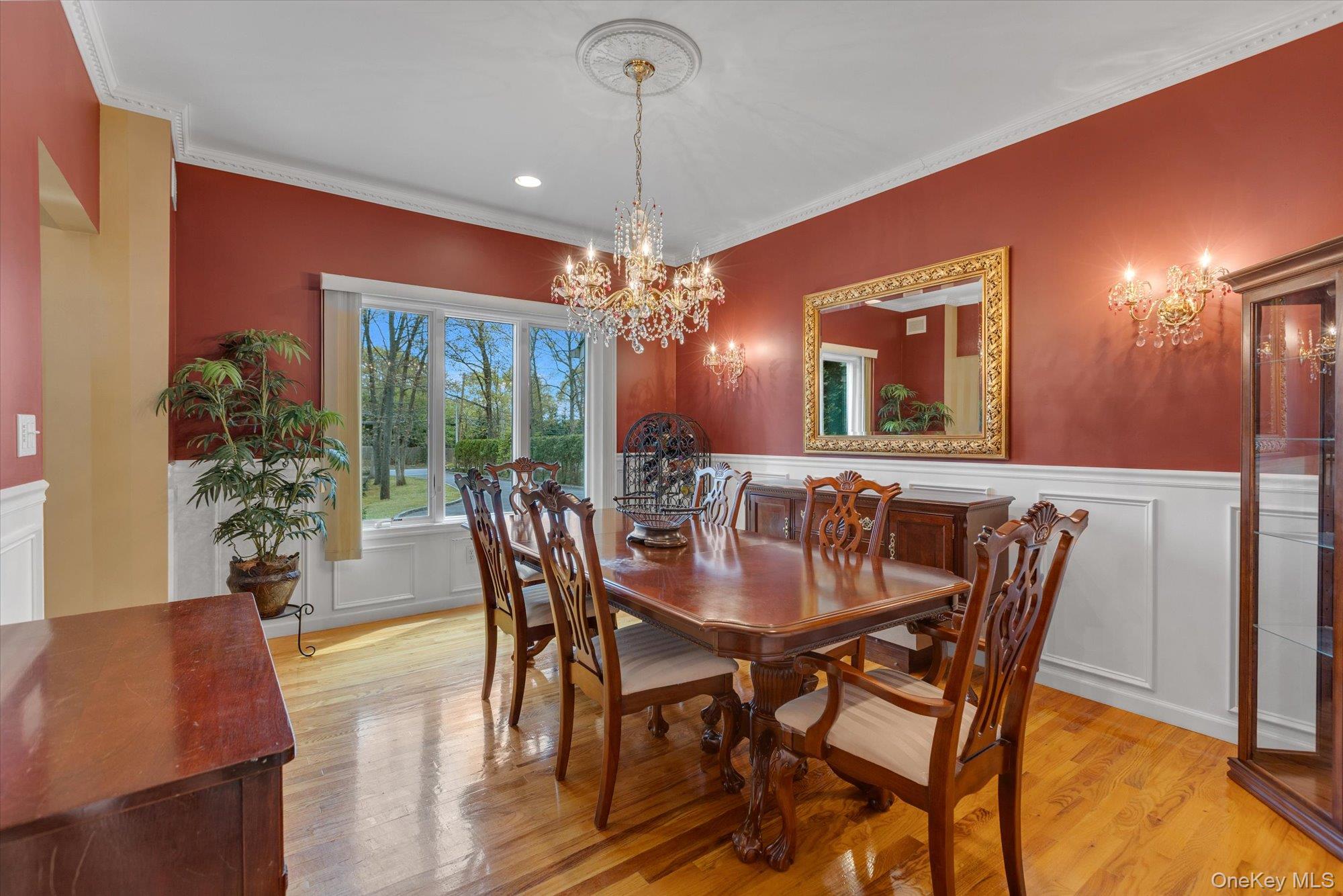 263 Old Commack Road Kings Park, NY 11754 - Photo 7 of 42 a view of a dining room with furniture and chandelier