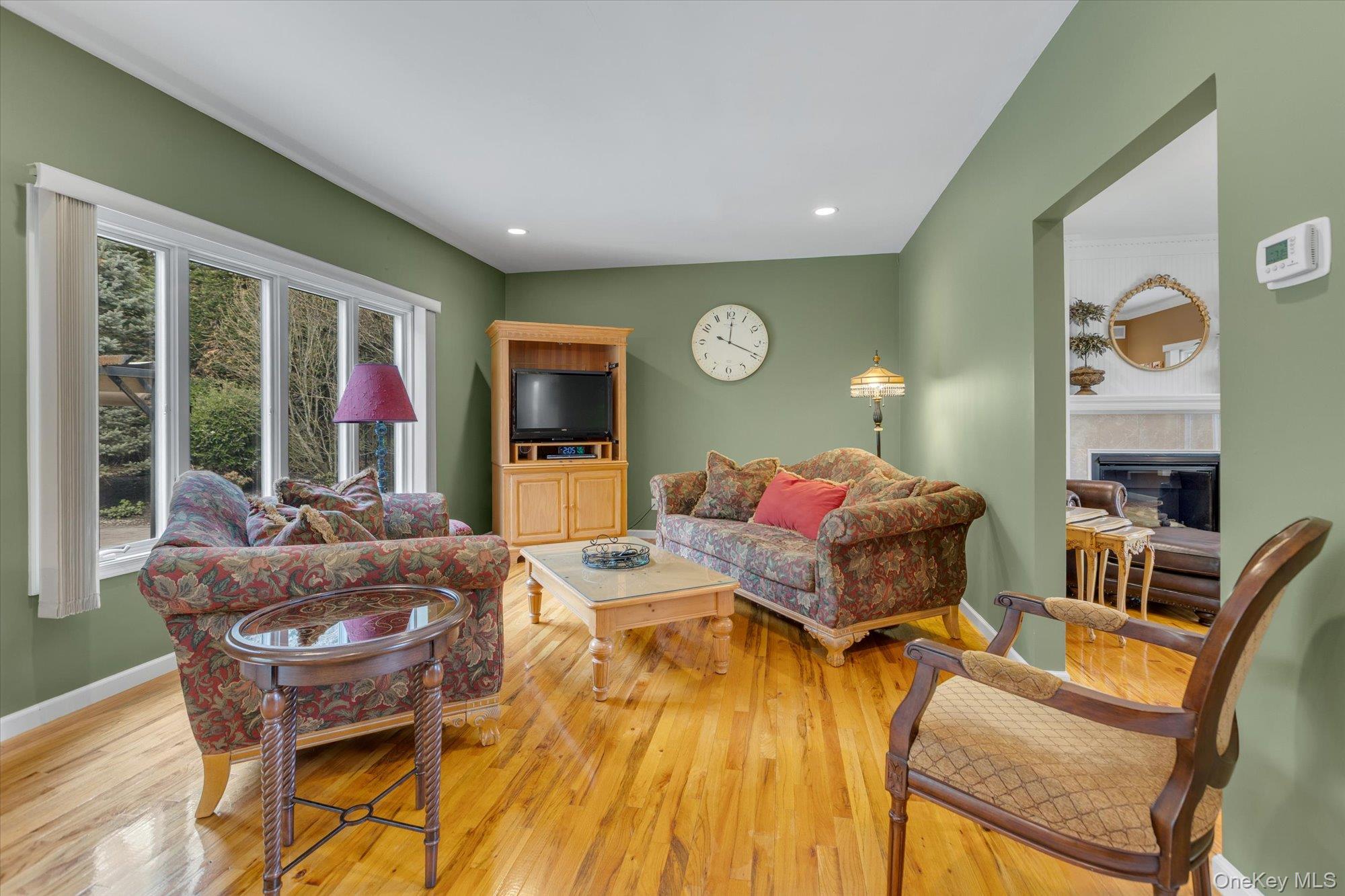 263 Old Commack Road Kings Park, NY 11754 - Photo 9 of 42 a living room with furniture and a large window