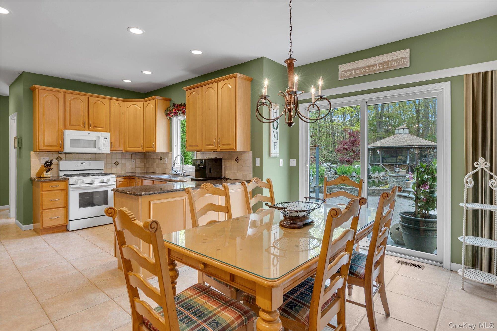 263 Old Commack Road Kings Park, NY 11754 - Photo 10 of 42 a view of a dining room with furniture window and outside view
