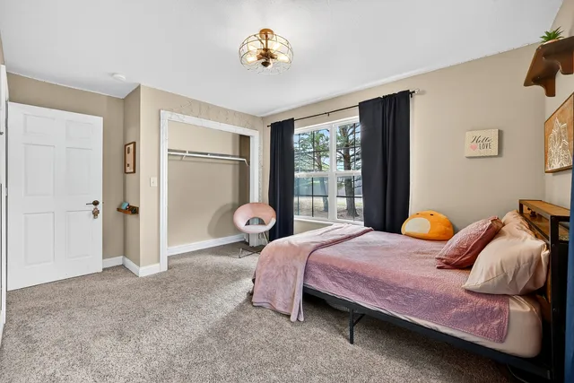 a bathroom with a toilet and a shower curtain