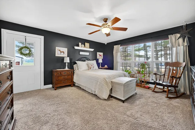 a bathroom with a shower a toilet and a sink